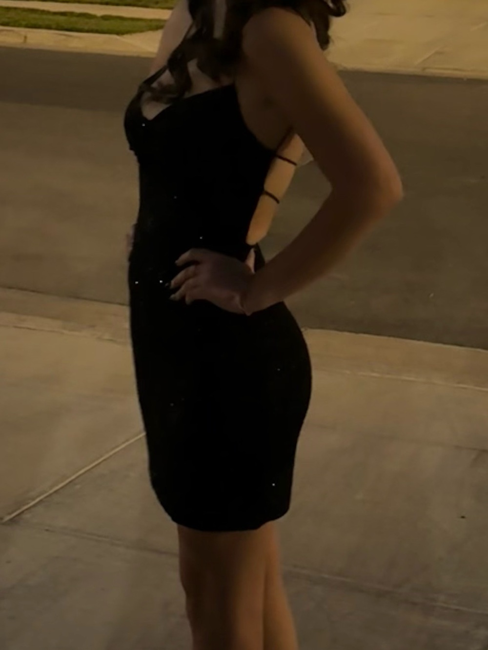 Elegant Black Sleeveless Mini Dress with Open Back